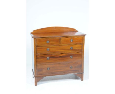 An Edwardian inlaid mahogany chest of drawersWith an arched raised back above a rectangular moulded top, two short and three 