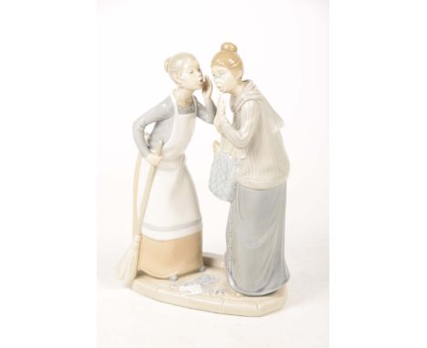 A Lladro group Modelled has two woman gossiping, one holding a broom, the second holding a bag of bread, 31cms 