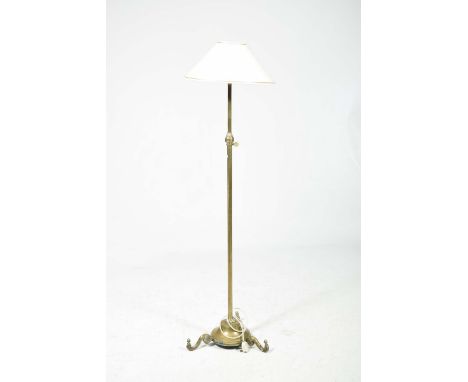 An early 20th Century telescopic brass lamp standardMounted within a circular plinth base with three S shaped supports