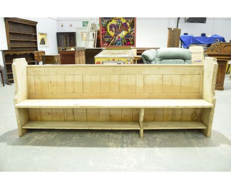 A Victorian weathered pine church pewWith a board back and plank seat above an undershelf raised on two angle cut bracket sup