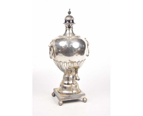 A 19th Century silver plated SamovarThe removable cover with a spherical finial above a lobed and domed top, mounted within g