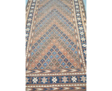 A North Afghanistan Chobash wool runner The central panel with a scale effect design within a blue border with a repeating pa