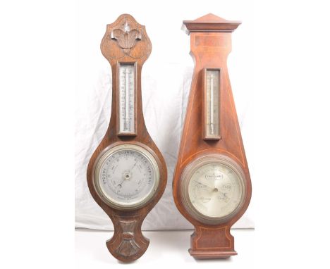 A mahogany framed and inlaid aneroid barometer early 1900Barometer with inset thermometer, height 59cms, further near matchin