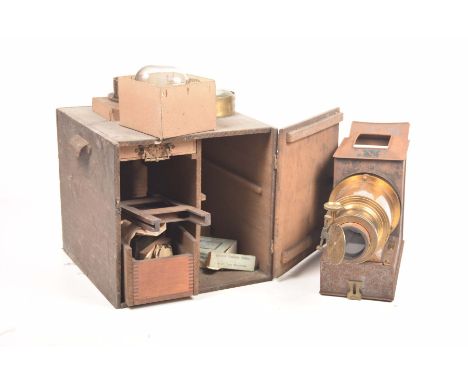 A brass and metal slide projector, mid to late 19th CenturyThe 21cm projector scope with shutter door, metal case, spare magn