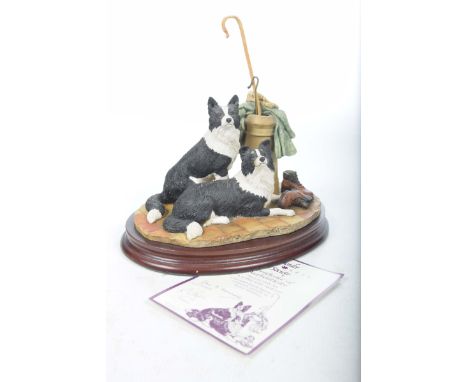 A Border Fine Art group, "A Long Day Ahead"Model No: B0037 by R. Ayres, mounted upon an oval hardwood plinth, complete with b