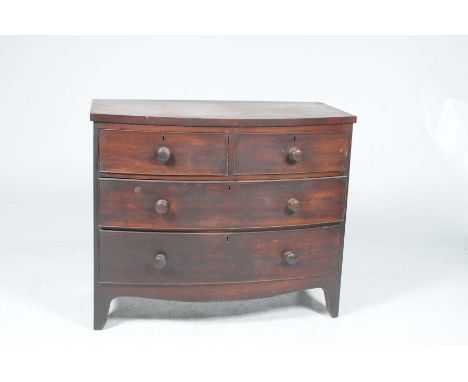 A Victorian mahogany bowfront chest of drawersWith two short drawers over two long drawers, turned wooden handles and outswep
