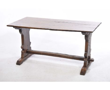A rustic elm plank top refectory tableThe rectangular three plank top supported on two substantial bracket supports with a gn