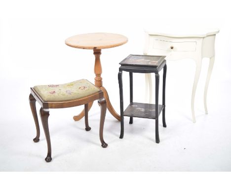 Four items of furnitureTo include small white painted side table with a single drawer on curvilinear legs, a two tier Japanne