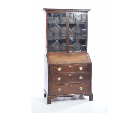 A George lll oak bureau bookcaseWith a moulded cornice above a pair of astragal glazed doors enclosing two shelves, the lower