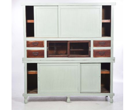 A painted pine Japanese cabinet, 20th CenturyWith two sliding doors enclosing a single shelf above a pair of central glazed s