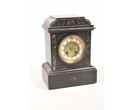 A slate and variegated marble mantle clock, late 19th early 20th CenturyMovement with coil chime, 10cm dial, enamel face with