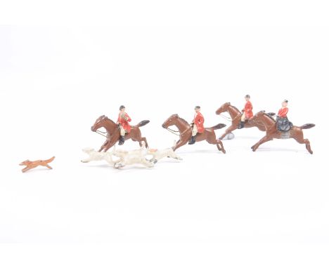 A painted lead hunting group, early to mid 20th CenturyComprising four riders in hunting coats (one lady ridding side-saddle)