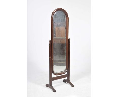 A modern Cheval mirrorWith a rounded bevelled mirrored plate supported on channelled uprights with bracket supports, height 1