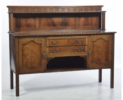 An early 20th Century Chippendale Revival mahogany sideboardThe raised back with a blind fret work frieze over a single shelf