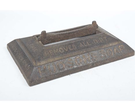 An early 20th Century advertising cast iron boot scrapper, Hudson's SoapOf caddy form with a central scrapping rail above gra