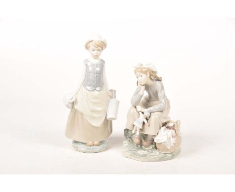 Two Lladro figuresThe first modelled has a young girl holding two milk churns, and the second a young girl with pigtails sat 
