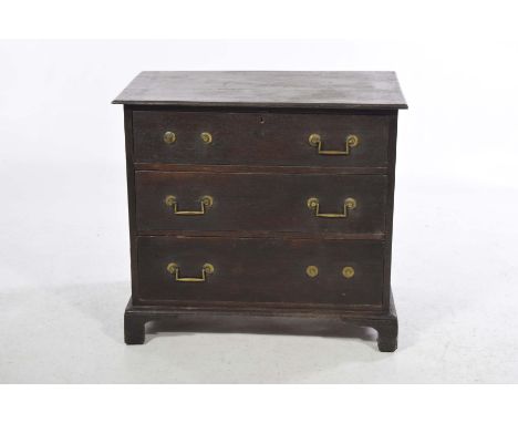 A 19th Century oak chest of drawersWith the rectangular three plank moulded top above three long drawers each with angular ir