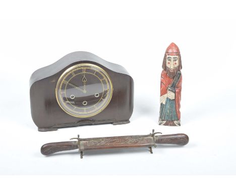 An early 20th Century mantle clock, Burmese hardwood carving set and carved figureThe mantle clock with a three train movemen