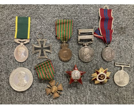 * Prussia. Iron Cross, 2nd Class, hallmarked on the suspension ring, 45 x 45 mm, together with various medals including Terri
