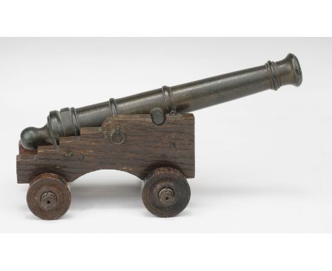 * H.M.S. Royal George. A bronze model cannon, the bronze cannon engraved 'Relic of the Royal George, Sunk 1782, Raised 1840',