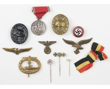 * Third Reich. Luftwaffe peaked cap badge, brass with lacking one lug, 65 mm long, together with various related items includ