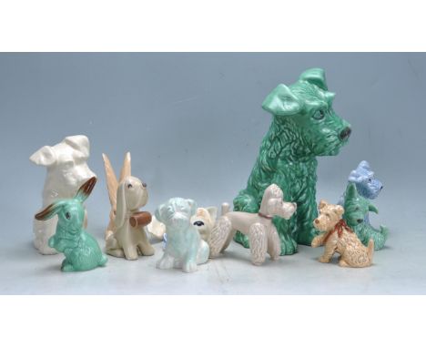 A collection of eleven vintage 20th century Sylvac ceramic figurines comprising of mainly dogs. Largest measures 32 cm high. 