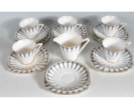 A vintage 20th century Corinth porcelain tea set comprising of cups, saucers, cake plates (trios) and creamer. The set has bl