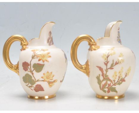 Two antique Victorian 19th Century Royal Worcester Aesthetic movement blush ivory jugs having floral decoration with gilt emb