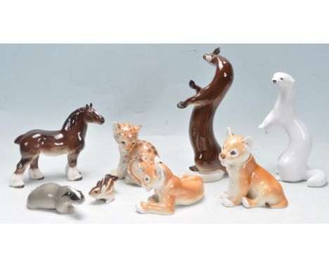 A collection of vintage 20th century ceramic animal figurines having polychrome decoration throughout. The collection include