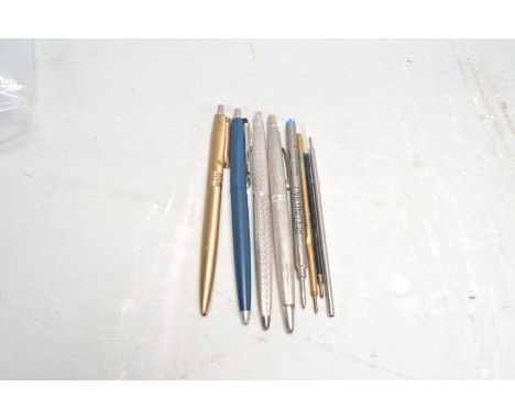 A group of vintage pens to include a silver hallmarked engine turned example (hallmarked Birmingham 1976, makers marks WM), a