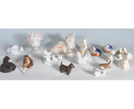 A large collection of ceramic animal ornaments to include a Beswick foal, Beswick duck, Royal Belvedere cat figurine, and var