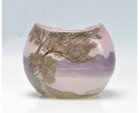 A vintage retro 20th century studio glass French Legras vase. The vase of a pebble form decorated with green trees on a purpl
