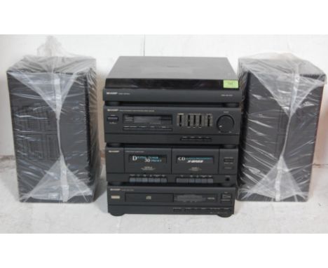 A late 20th century vintage Sharp model CMS-150CDE Hi-Fi stereo musical audio stacking system comprising of record deck, tune