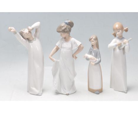 A collection of four vintage 20th century Spanish ceramic porcelain figurines to include three Lladro figurines of children’s