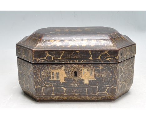 A 19th century Chinese tea caddy formed of ebonised wood with hand painted gilt detail depicting lotuses and figural scenes. 