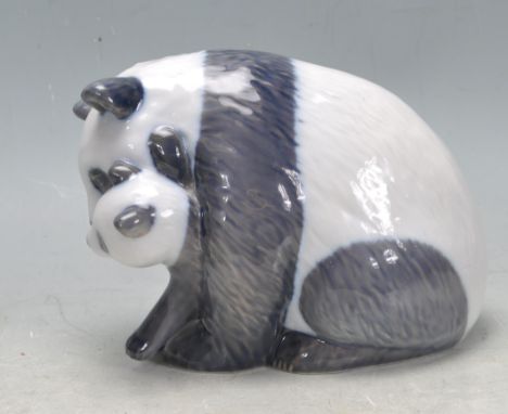 Two 20th Century Royal Copenhagen ceramic figurines to include a Panda bear figurine group depicting mother and cub (no. 666)