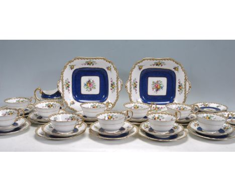 A 20th century antique style ceramic porcelain tea set by Aynsley. The tea set comprising of 10 cups, 12 saucers, 12 side pla