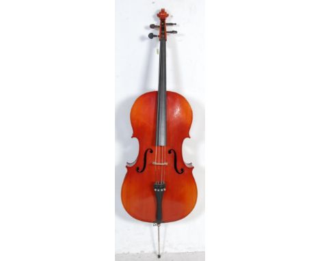 A vintage 20th century German made " Musima " cello musical instrument having wooden tuning pegs with makers label to the ins