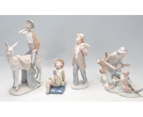 A group of four 20th century Spanish ceramic figurines to include two Lladro figurines of children balerine and a guy riding 