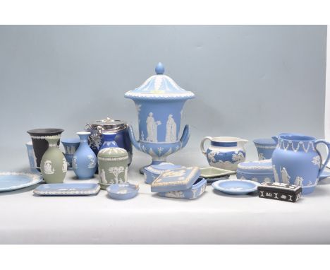 A collection of 20th century Wedgwood Jasperware ceramic ware to include vases, urn, pin disk jug, trinket box, etc. All deco