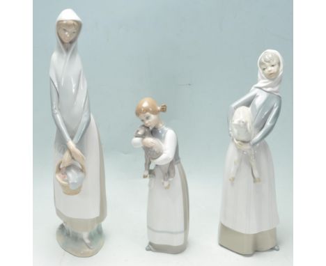 A collection of three vintage 20th century Spanish ceramic porcelain figurines by Lladro. The collection comprising of a lady