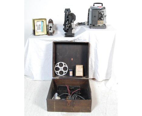 A collection of vintage 20th century film / video equipment comprising of a boxed Pathescope, a Bell &amp; Howell Moviemaster