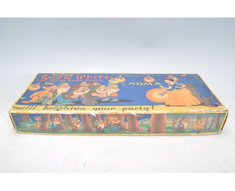 A set of vintage 20th century Walt Disneys Snow White and the Seven Dwarfs by Noma christmas lights. The set has polychrome d