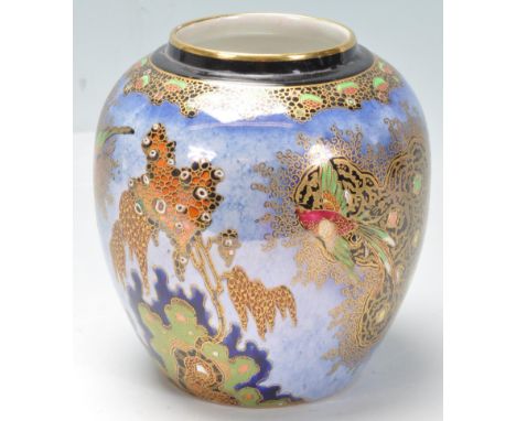 A vintage 1950s mid 20th century Carltonware sketching bird ginger jar of ovoid form having a blue background with gilt embel