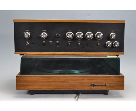 A retro vintage late 20th century Garrard SP25 MK IV synchronous motor vinyl audio hi fi turntable and amplifier stacking sys