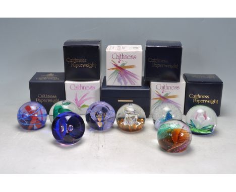 A collection of eight retro vintage late 20th century studio art glass Caithness paperweights to include Spinning Top, Opus 8