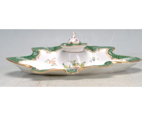 A 19th century Victorian Dresden inkwell set onto a oval base with scalloped edges having ornate hand painted &nbsp;garland d