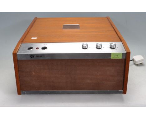 A vintage retro 20th century circa 1970’s PYE model 1011 record player with four speed deck set in a teak wood case with alum