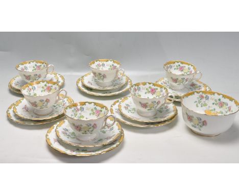 An early 20th century Atlas China tea set by Grimwade comprising of six cups, six saucers and six cake plates (trios) togethe