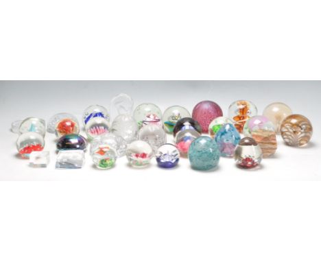 A large collection of retro vintage studio art glass paperweights to include Caithness - Flight of Fancy, Bubble control, mil